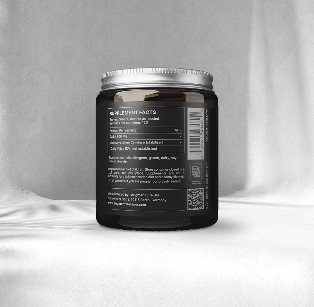 Black supplement container with label on a gray background