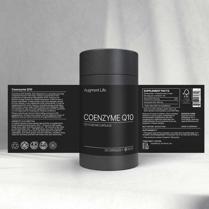 Black supplement container labeled 'Coenzyme Q10' with branding and nutritional information on a gray background
