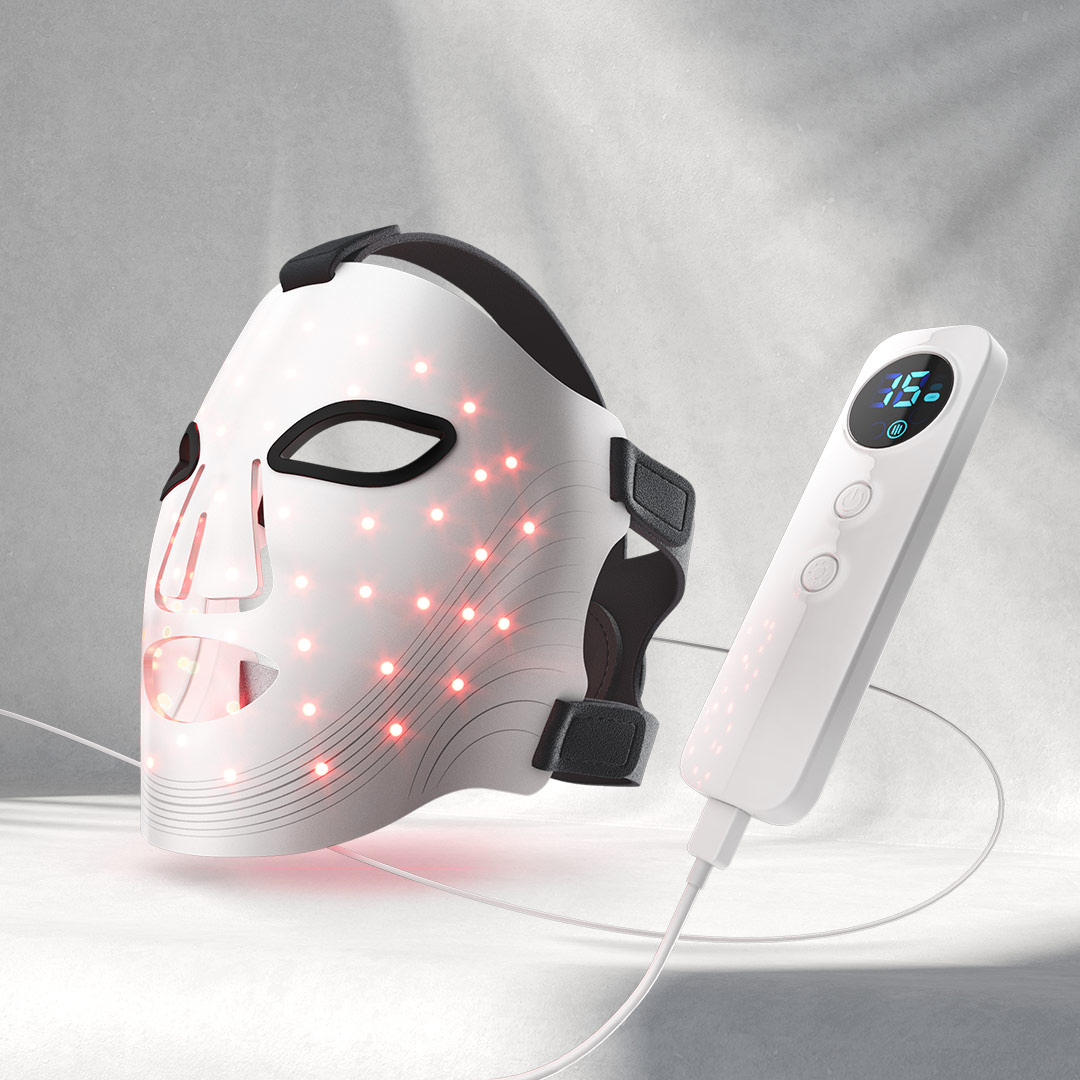 LED face mask with digital controller on a gray background