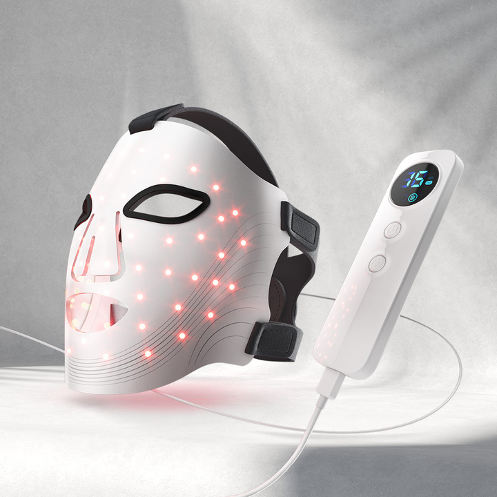 LED face mask with digital controller on a gray background