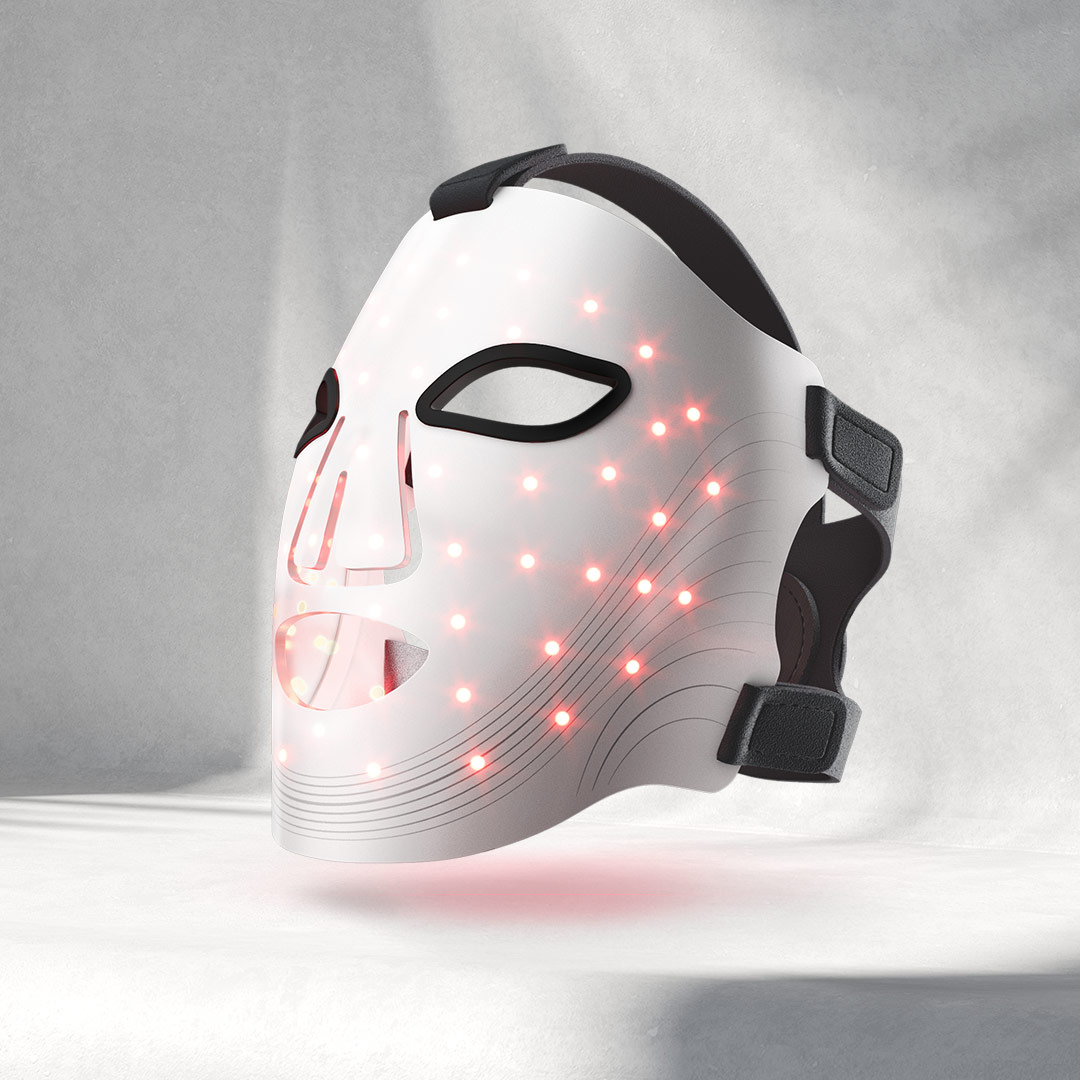 White mask with red LED lights on a gray background