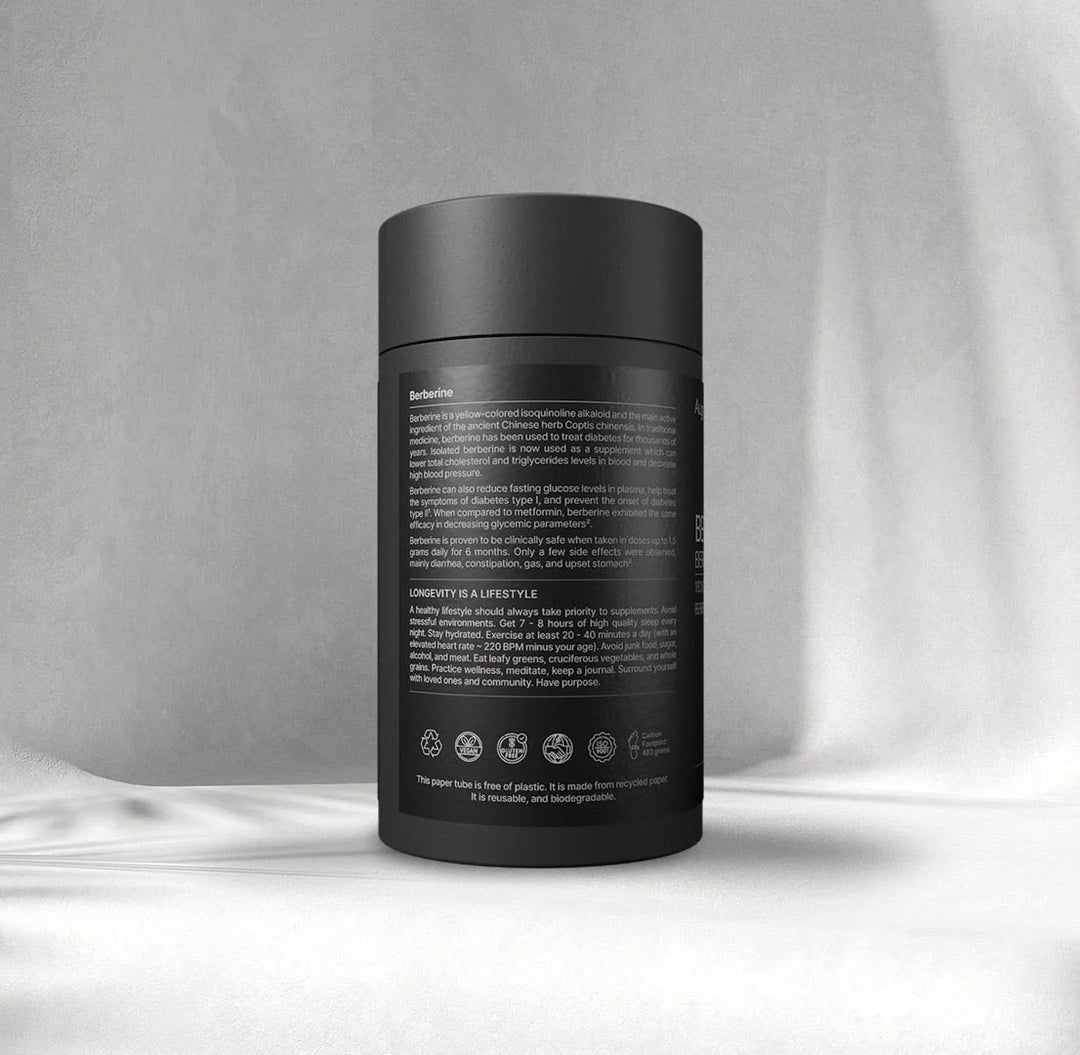 Black cylindrical container with text on a gray background