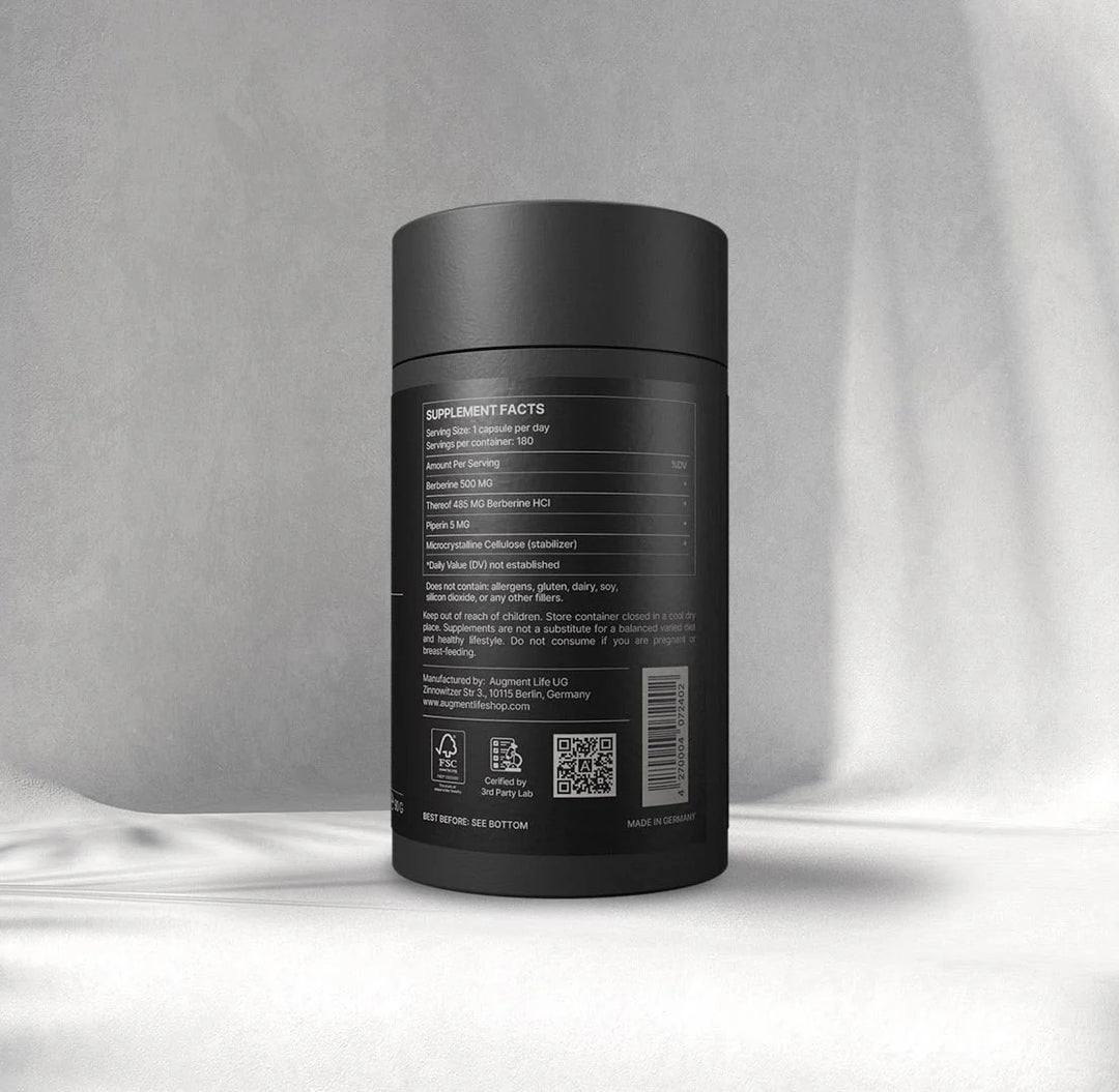 Black supplement container with label on a gray background