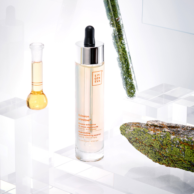 Epigeniva Eclosion Primitive Serum – bottle on display with moss, bark, and botanical elements