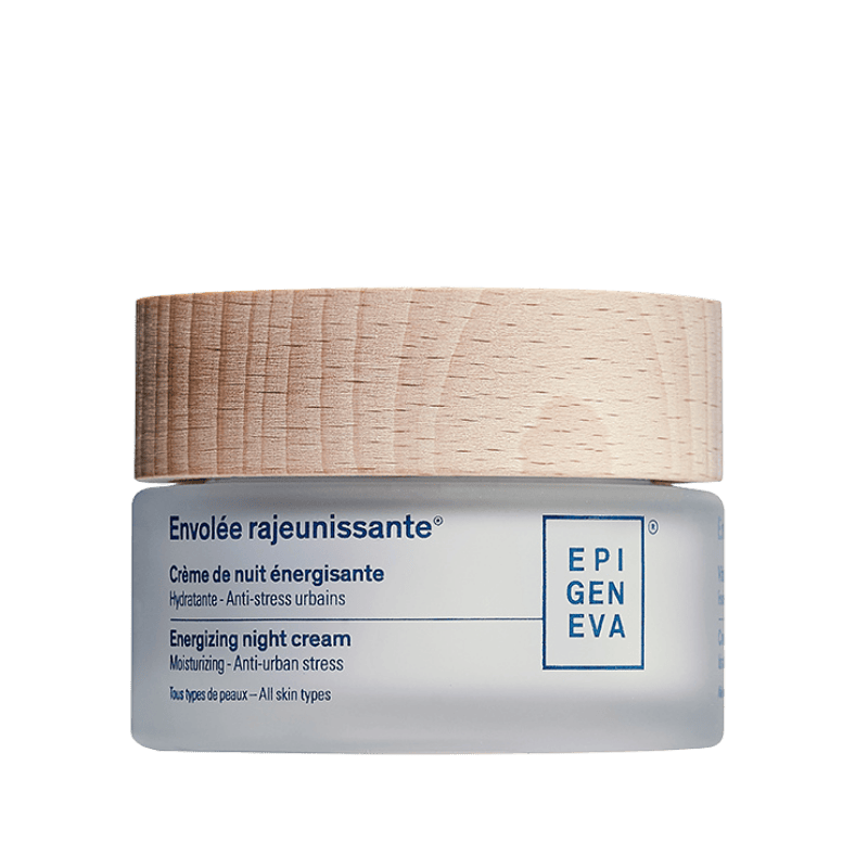 Energieva night cream jar with natural wooden cap on a green background