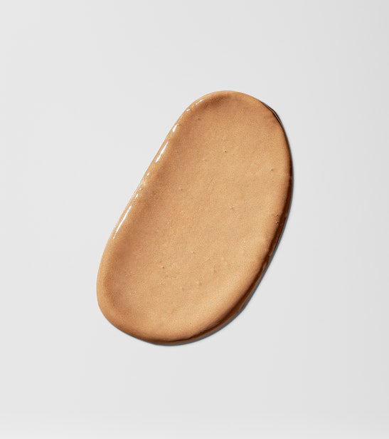 Brown oval-shaped product drop on a light gray background
