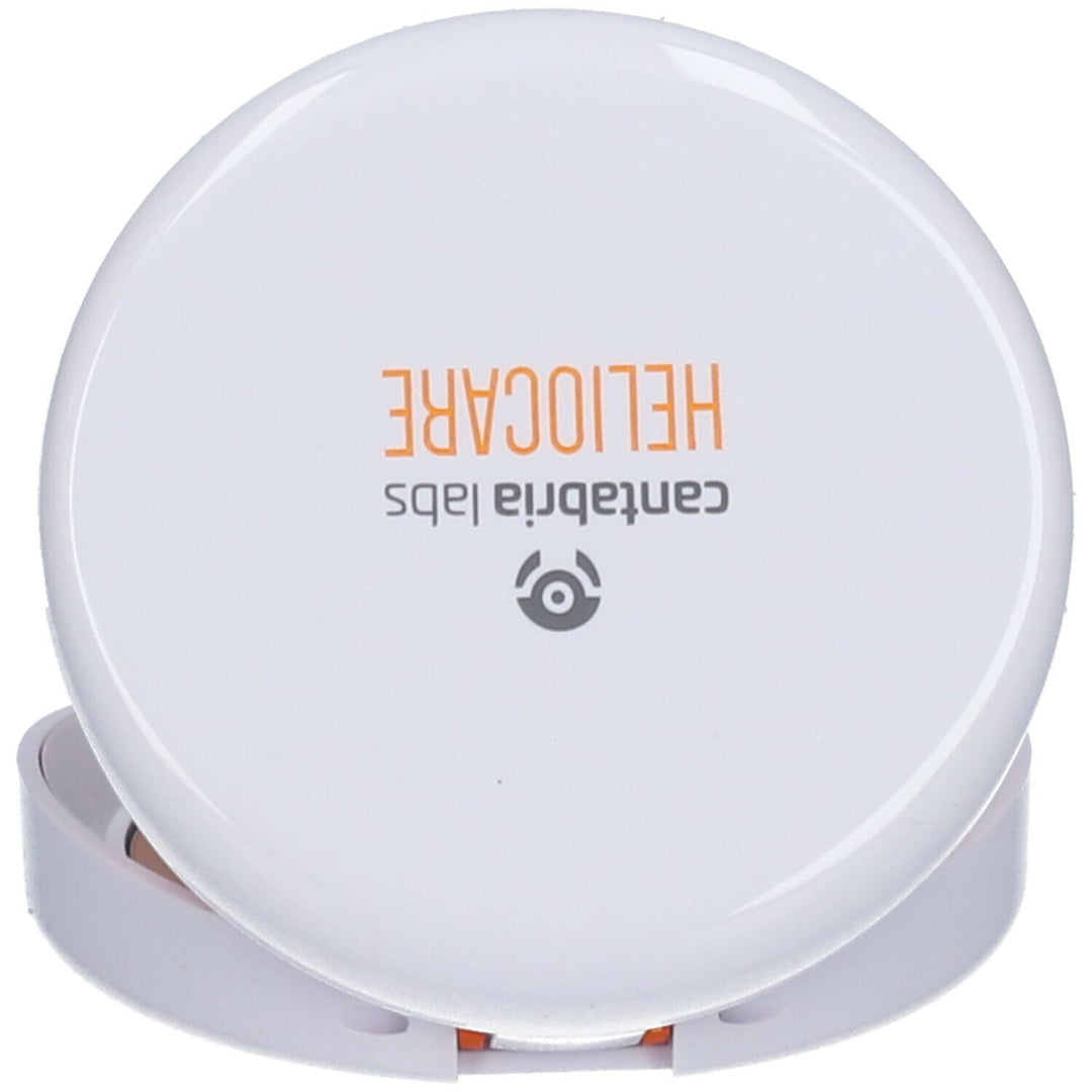 Compact white powder case with Heliocare logo on a white background
