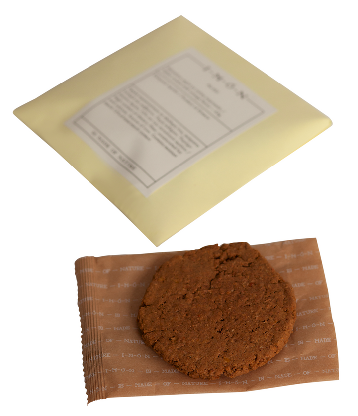 Brown cookie on a brown paper bag with a yellow envelope in the background