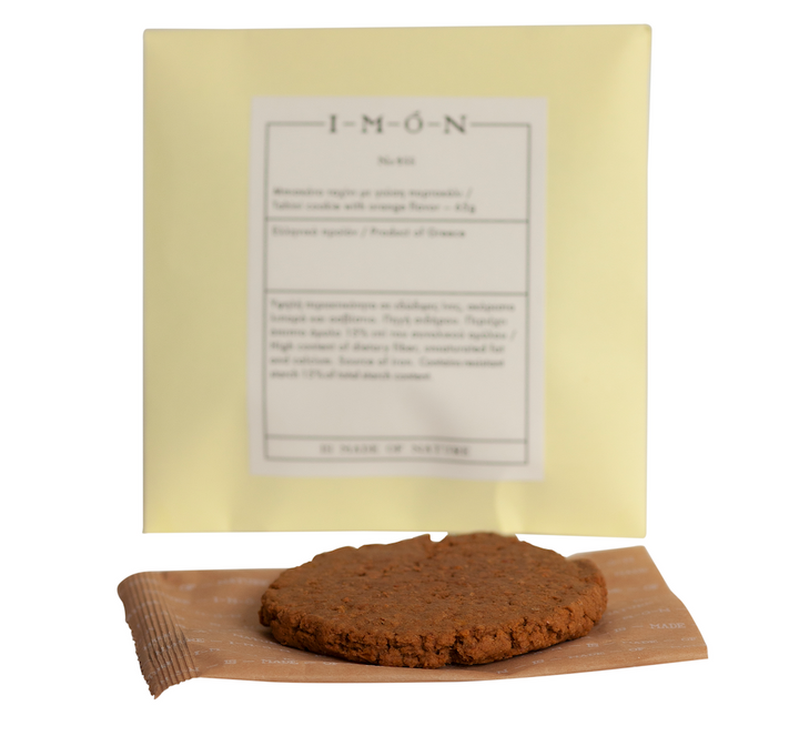 Cookies with a yellow packaging sheet featuring text on a white background