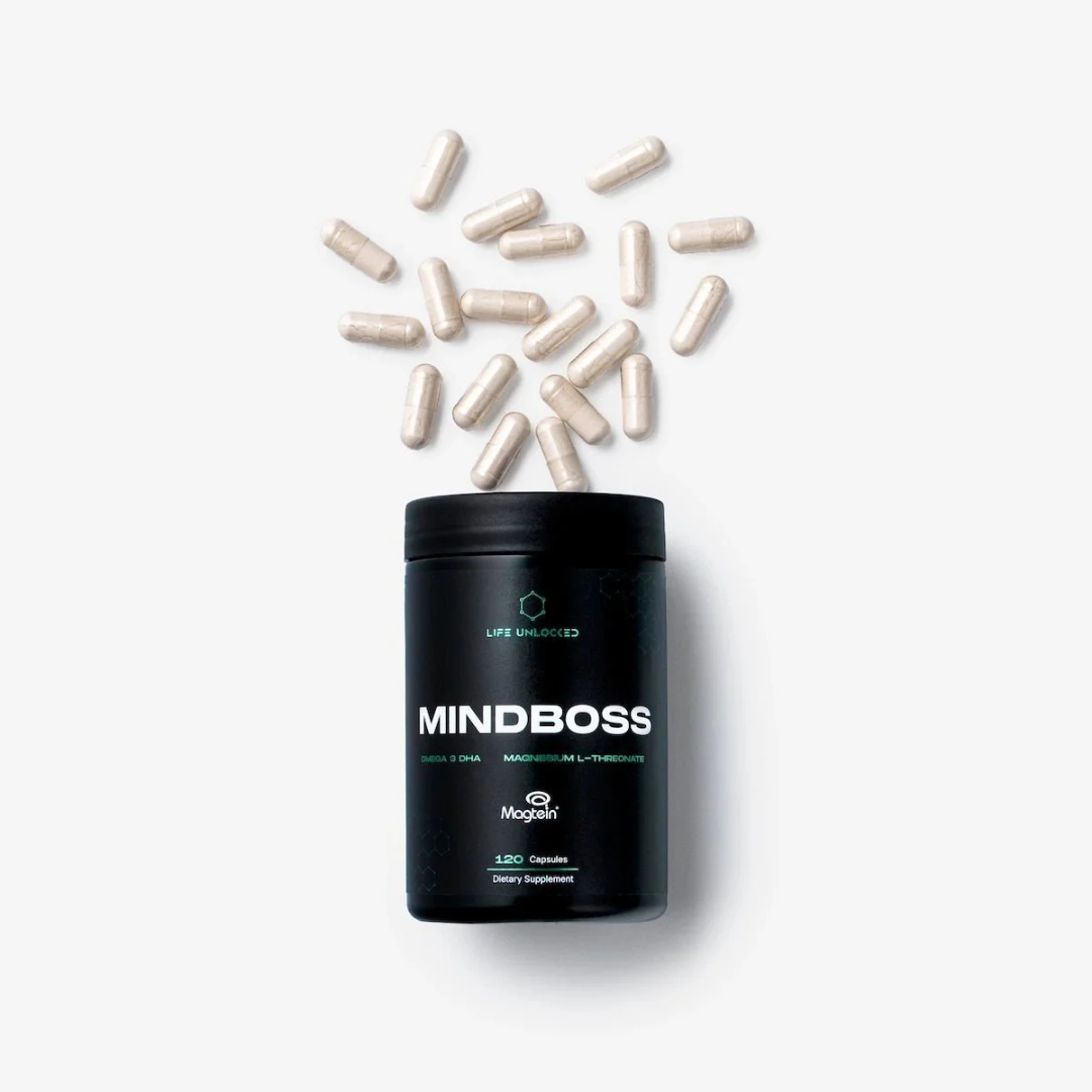 Black container labeled 'MINDBOSS' with scattered capsules on a white background
