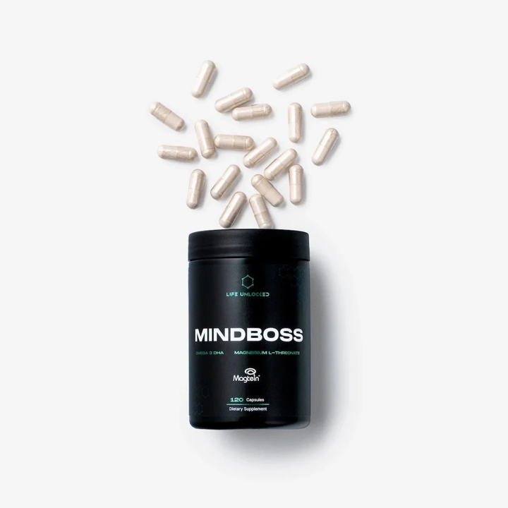 Black container labeled 'MINDBOSS' with scattered capsules on a white background