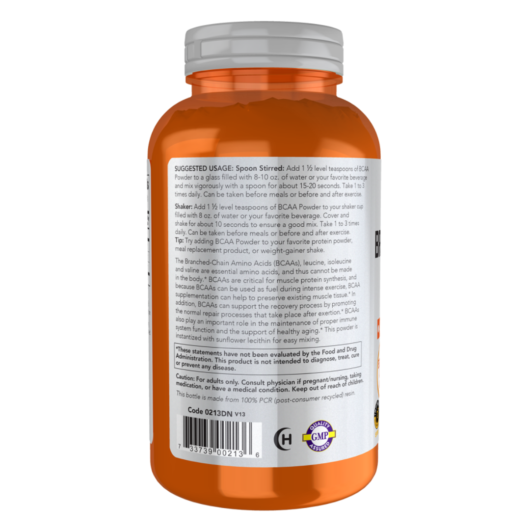 Orange supplement bottle with white label on a white background