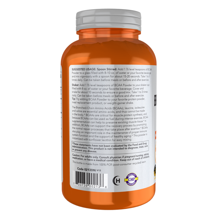Orange supplement bottle with white label on a white background