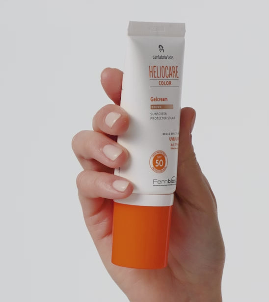 Hands applying Heliocare Color Gelcream SPF 50 to skin, showing tinted texture and finish