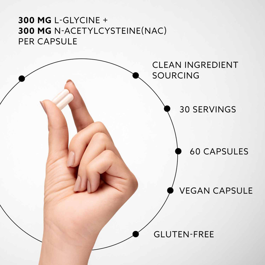 Hand holding two capsules with nutritional information text on a white background